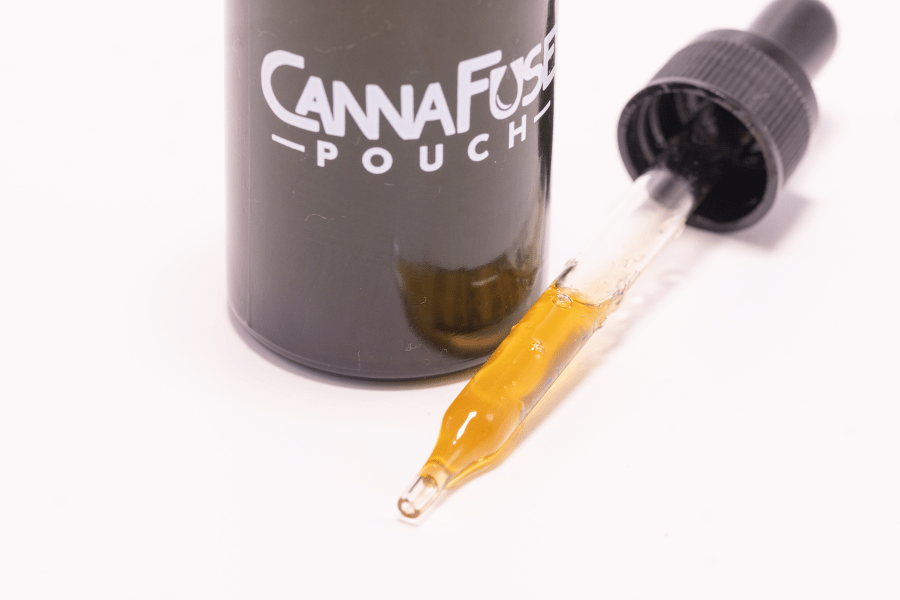 CannaFuse dropper bottle showing clear, properly infused cannabis oil
