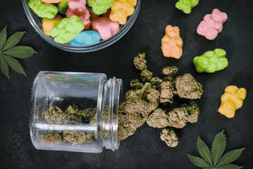 Jar of cannabis buds beside edible gummies showing the difference between decarboxylation and oil infusion processes